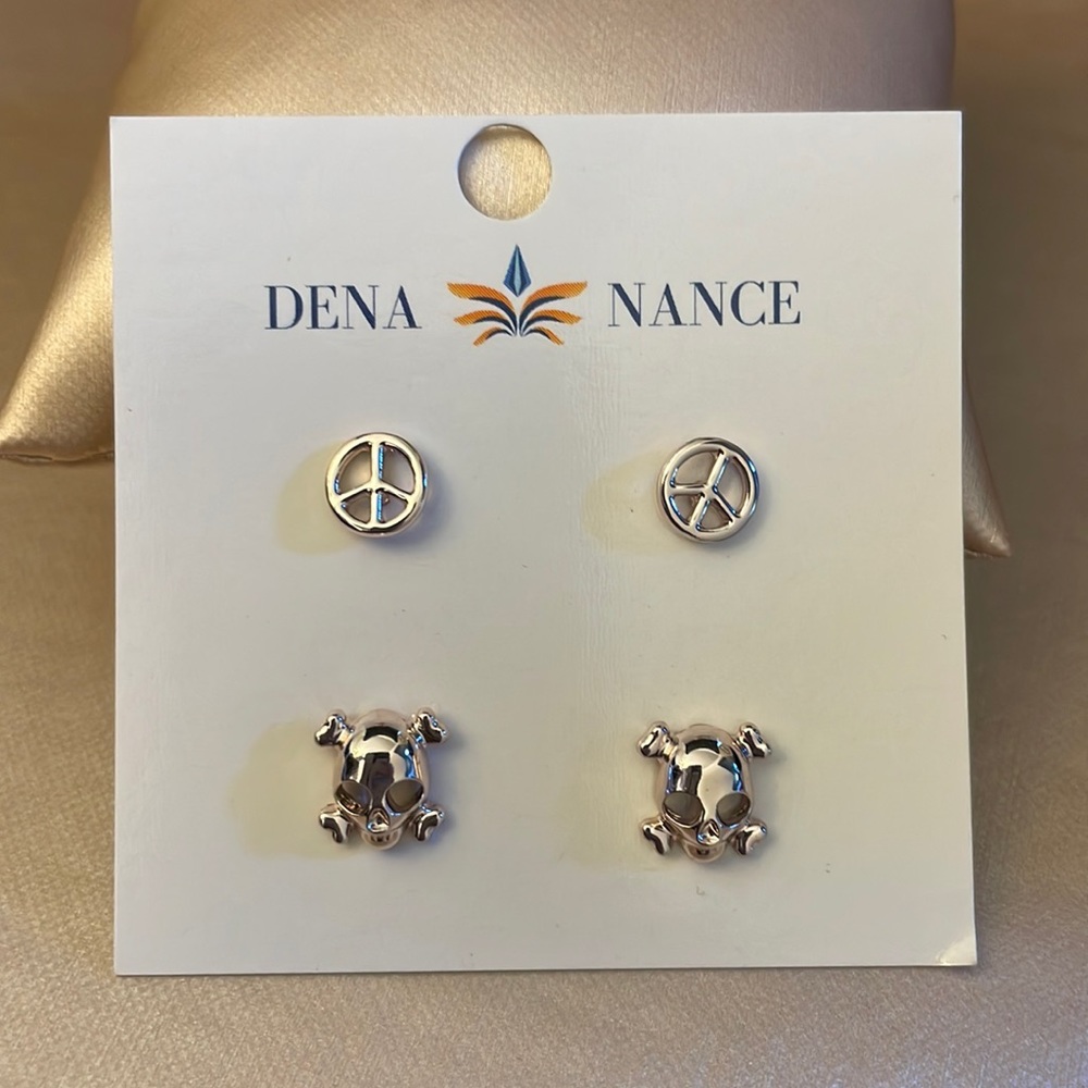Brand New Dena Nance pair of peace sign and skull studs